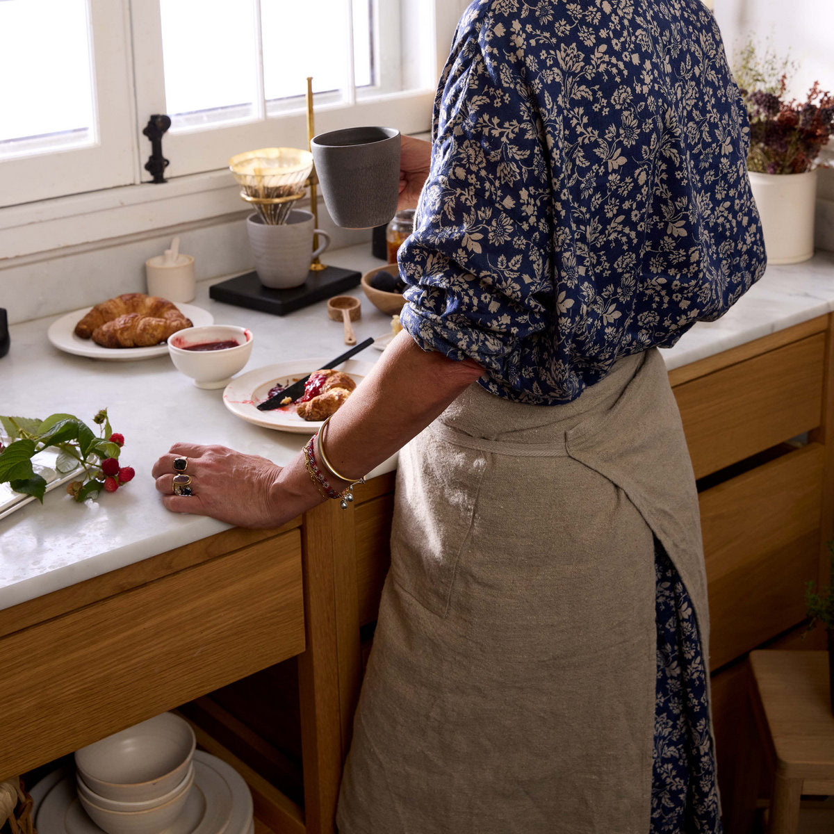 Natural linen apron with leather strap and front pockets for daily use
