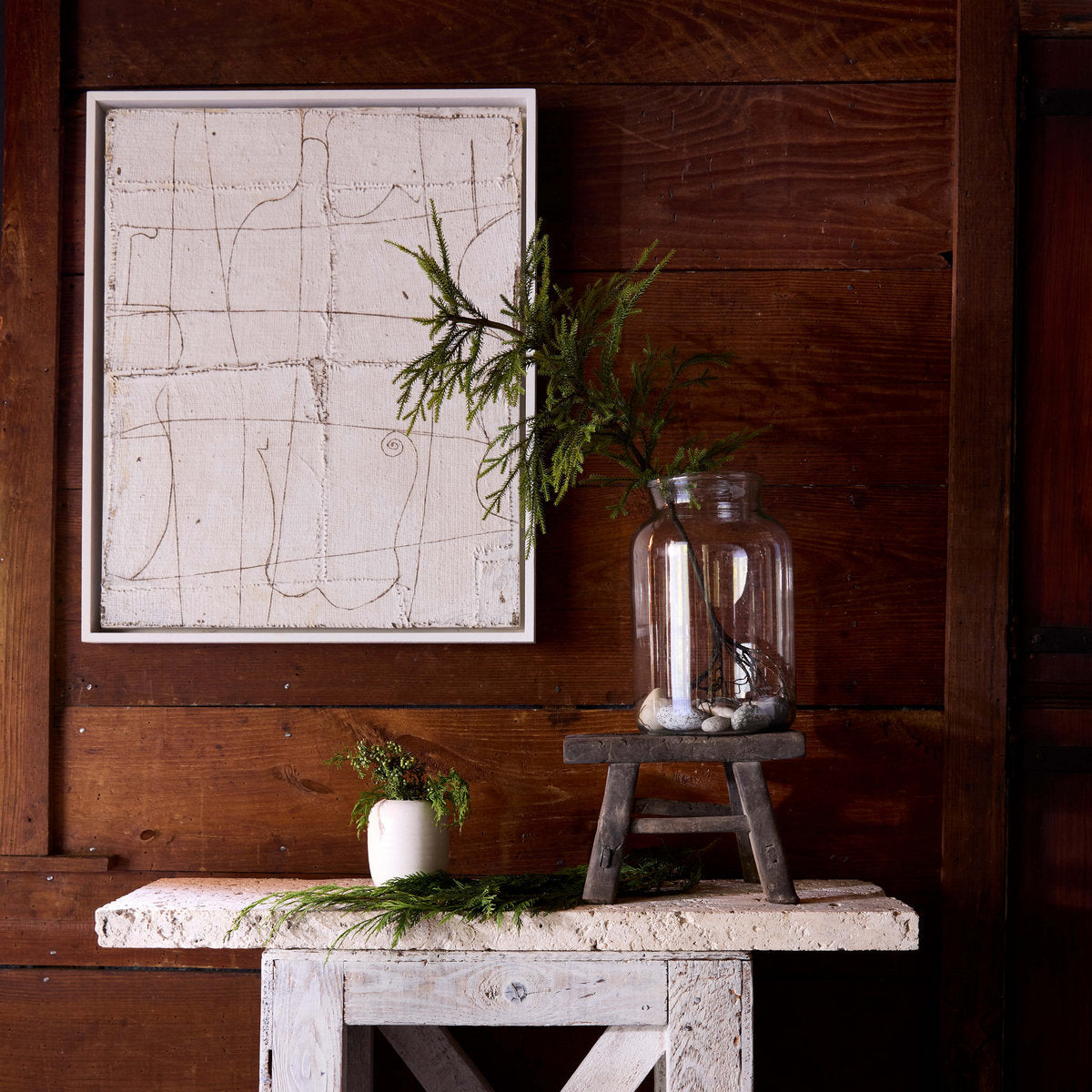 Minimal white ceramic vase and glass vase with balanced oval silhouette