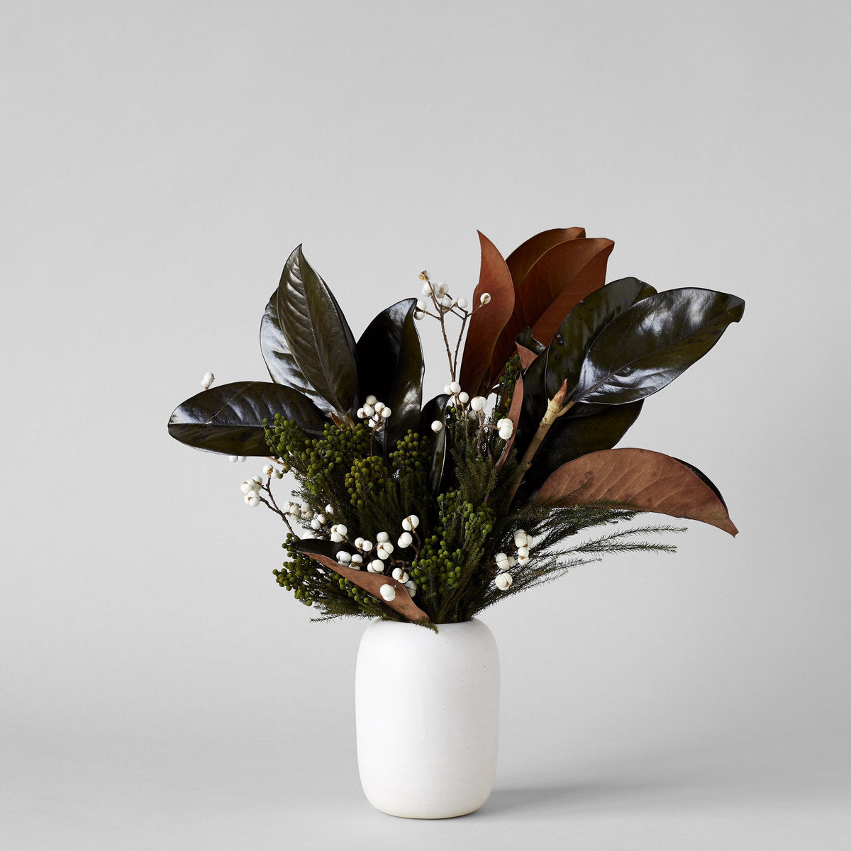 Hand-thrown glazed ceramic vase with matte chalky surface