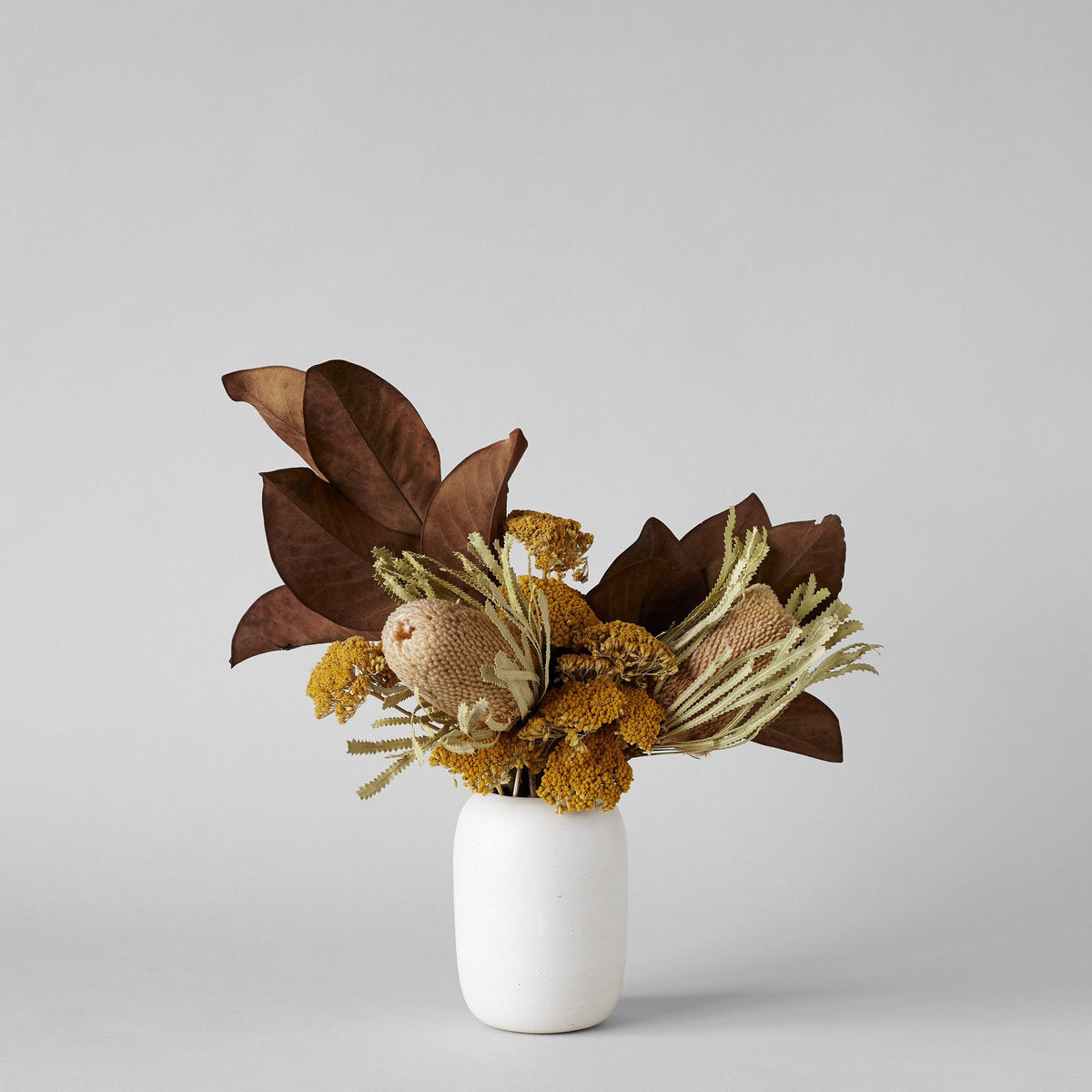 White oval vase with wide opening for natural stem arrangements