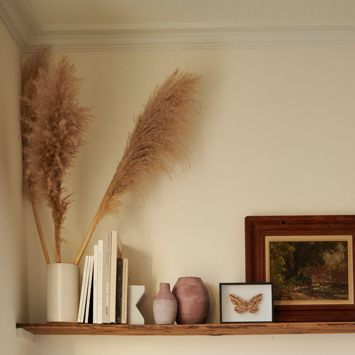 Soft pink ceramic bud vase with porcelain slip and subtle tonal variation