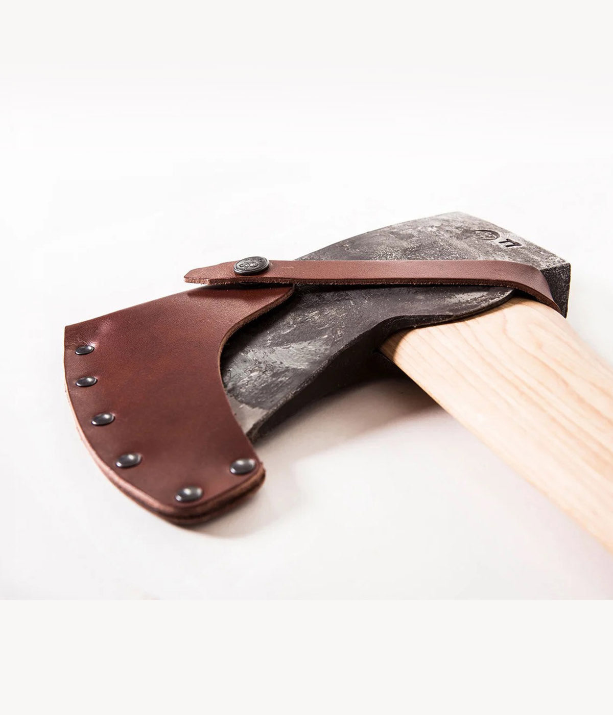 Forest axe with curved bit geometry for clean entry and release between strokes