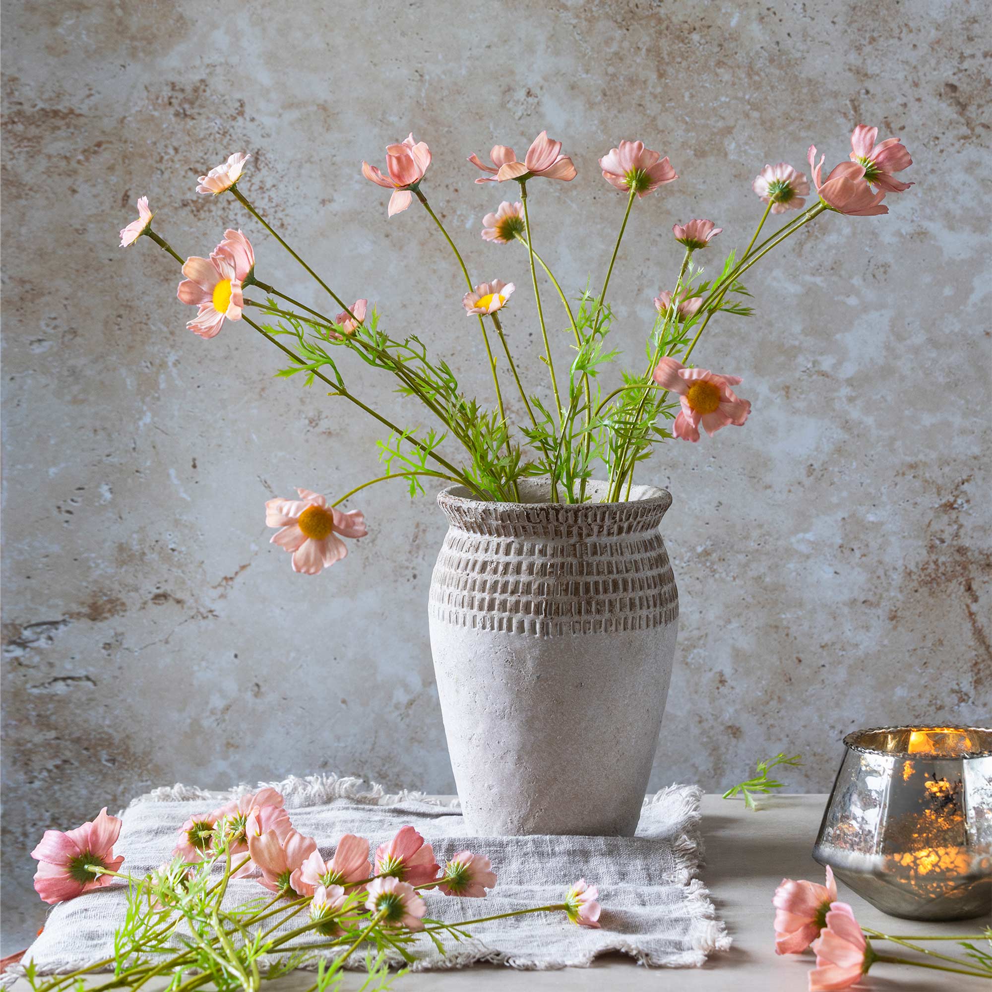 Blush pink artificial flowers with open meadow-style blooms