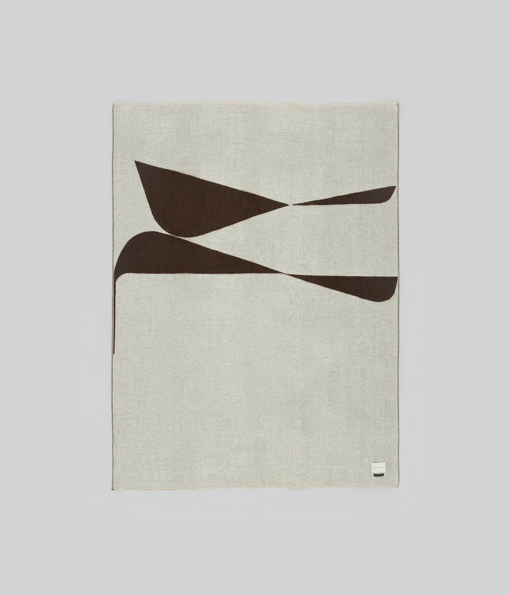 Berlin throw Ivory Coffee zero dye showing warm coffee forms on ivory ground