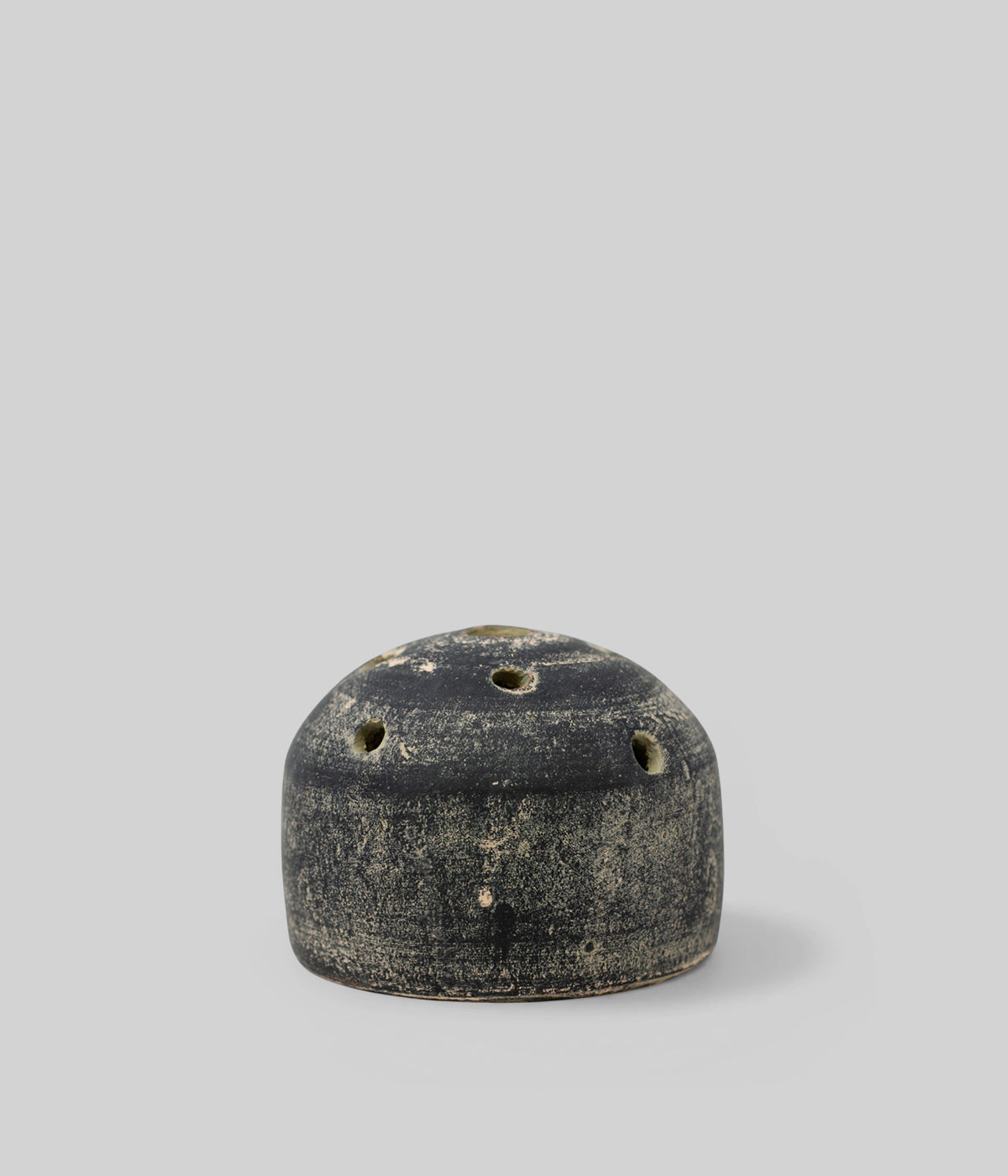 Small grey clay bud vase with low rounded shape