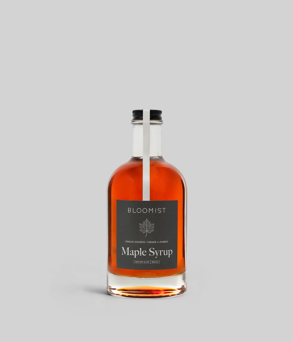 Grade A amber maple syrup with smooth texture and balanced mid-season sweetness