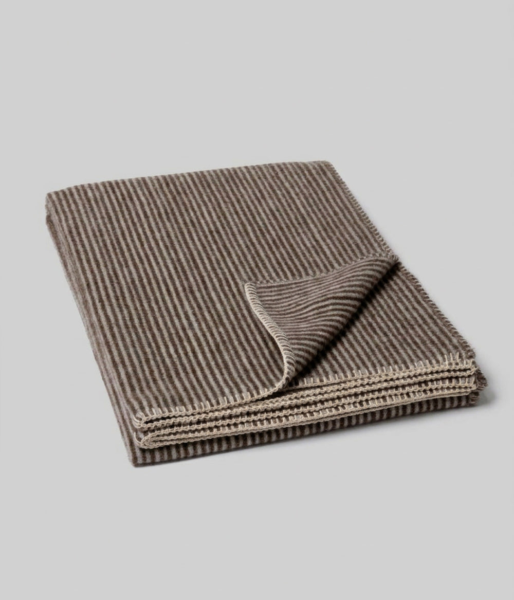Cortez reversible throw showing both faces at folded corner