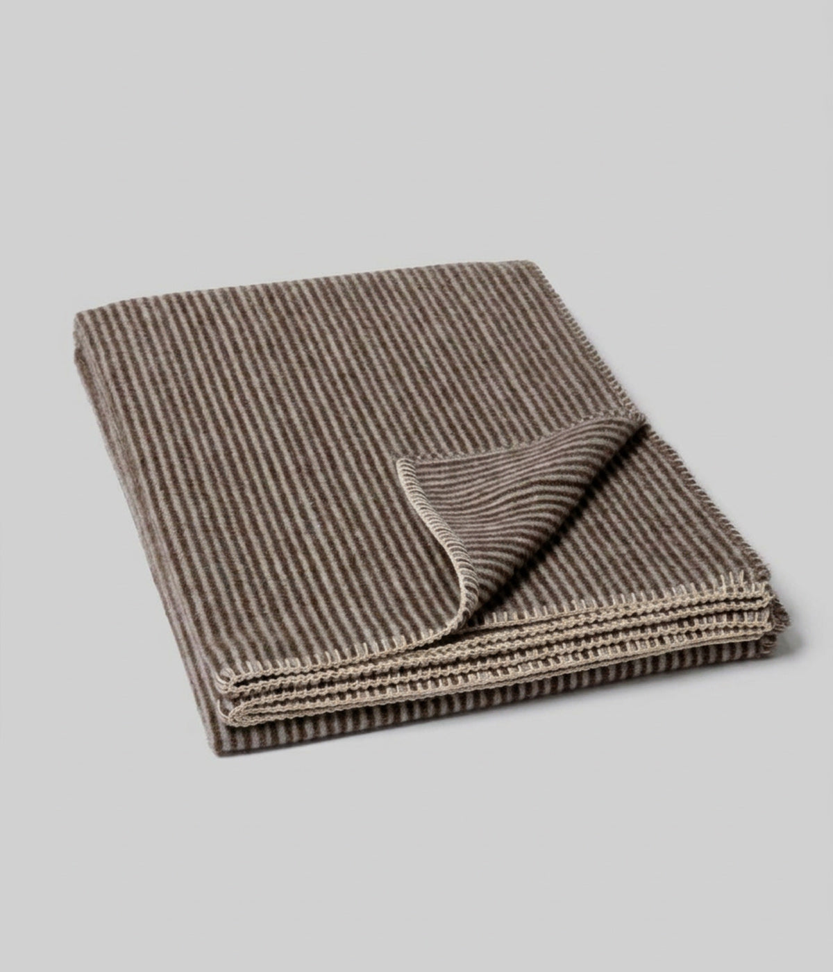 Cortez reversible throw showing both faces at folded corner
