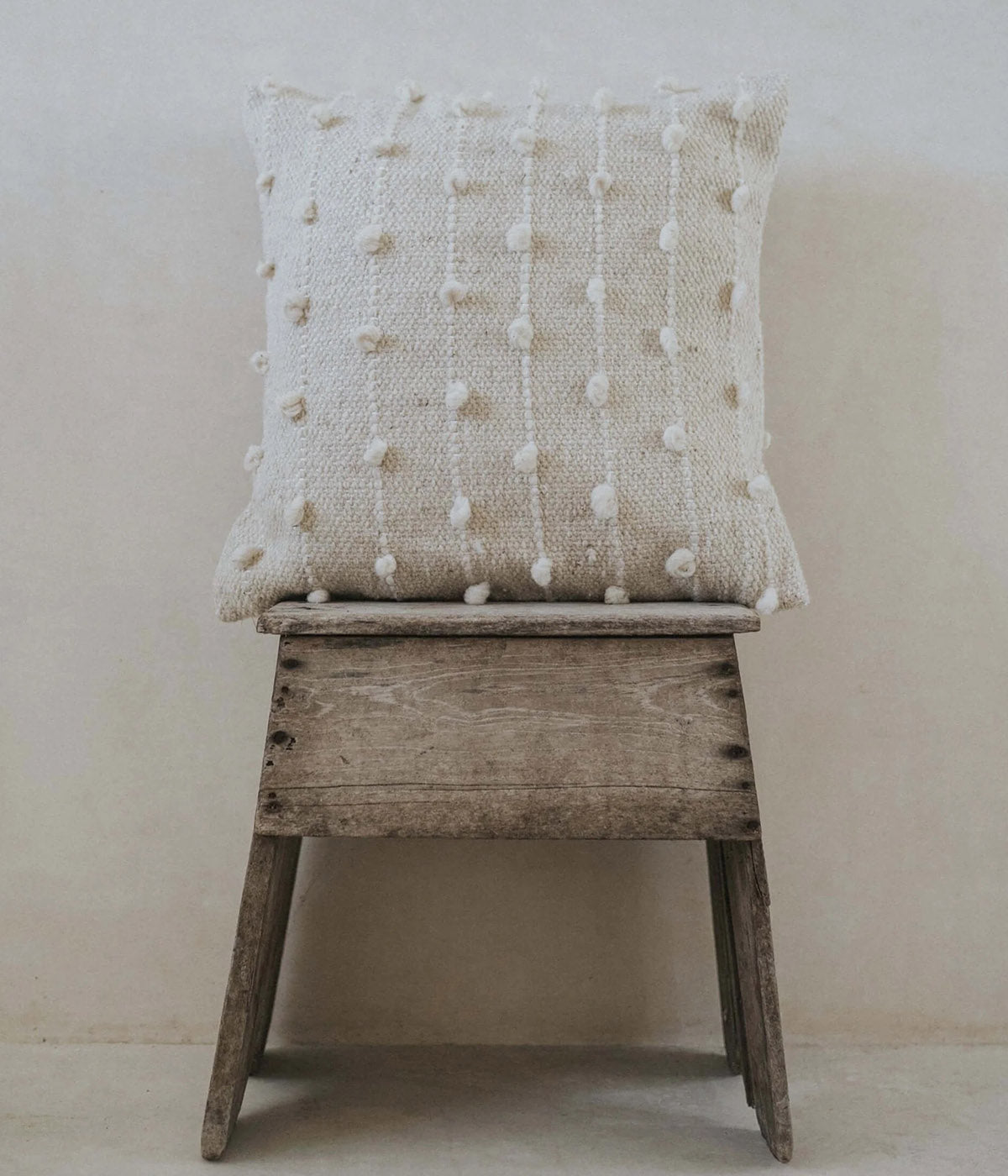 Handmade throw pillows with unique dot placement on every piece