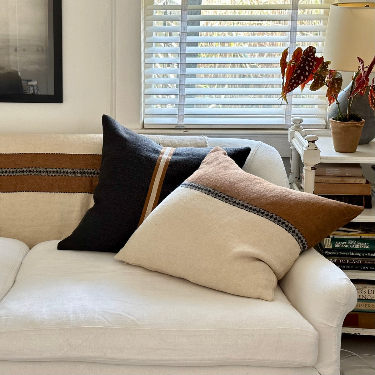 Artisanal pillow cover styled for relaxed layering in living or reading nook
