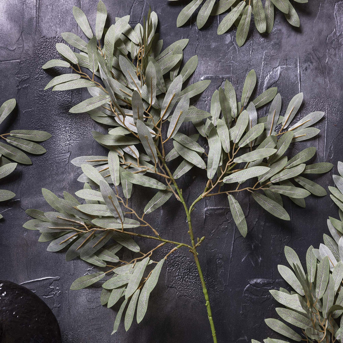 Soft green artificial willow stem with bendable design for flexible floral styling