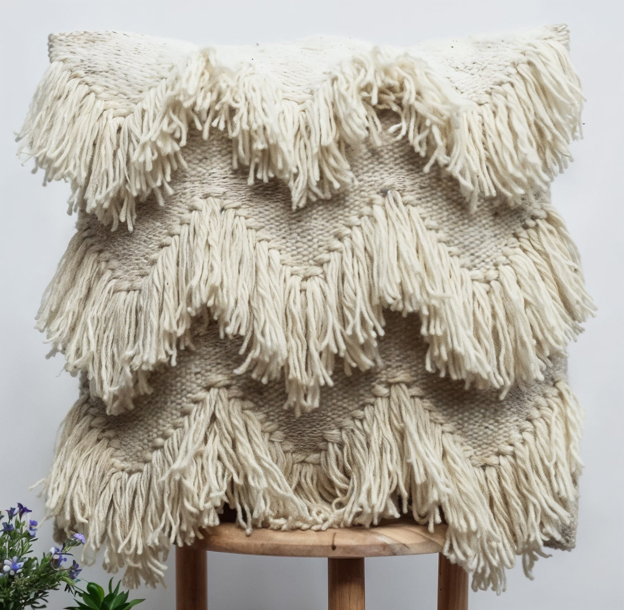 Textured pillow woven from 100% undyed hand-spun wool