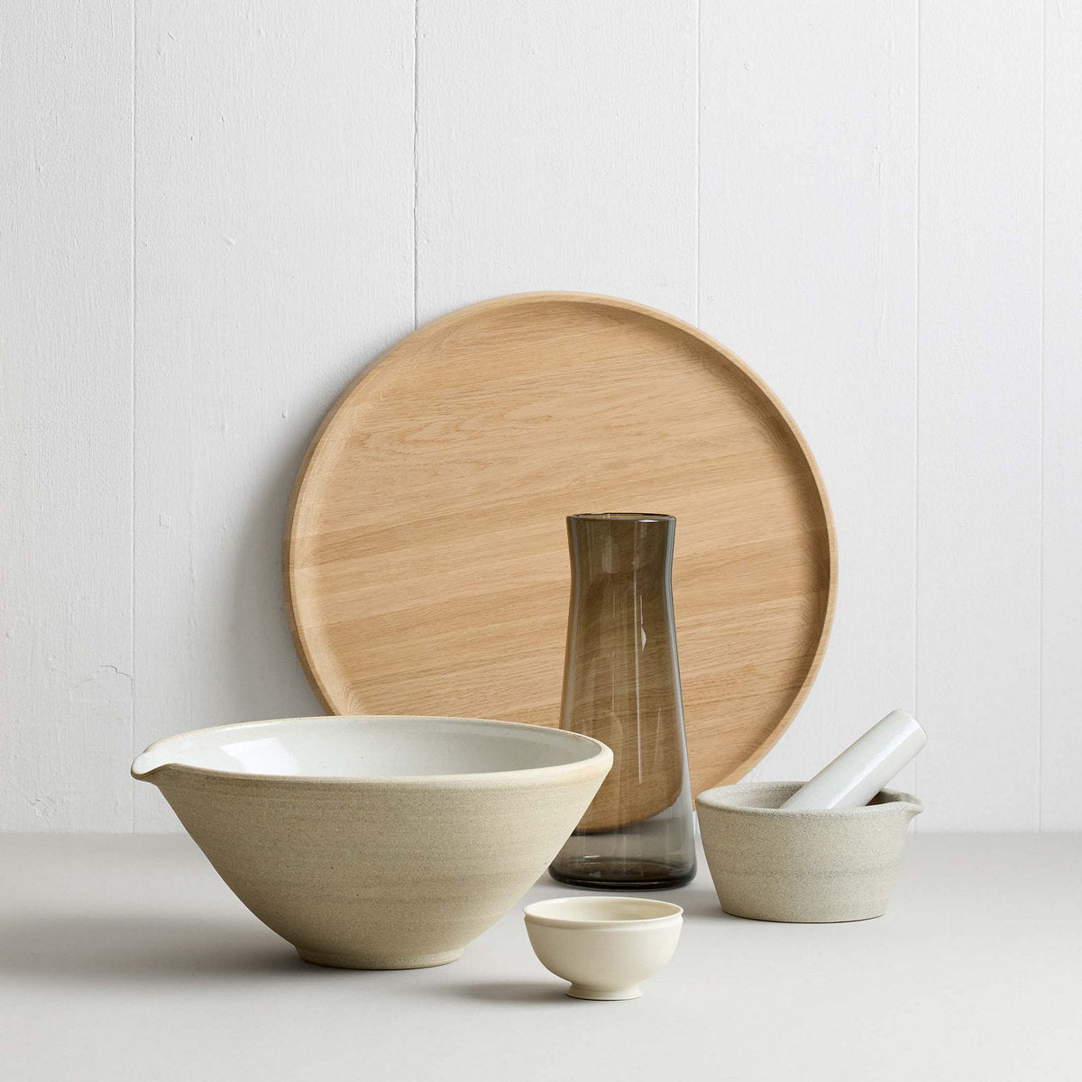 Ceramic mixing bowl with speckled clay exterior and smooth glaze inside