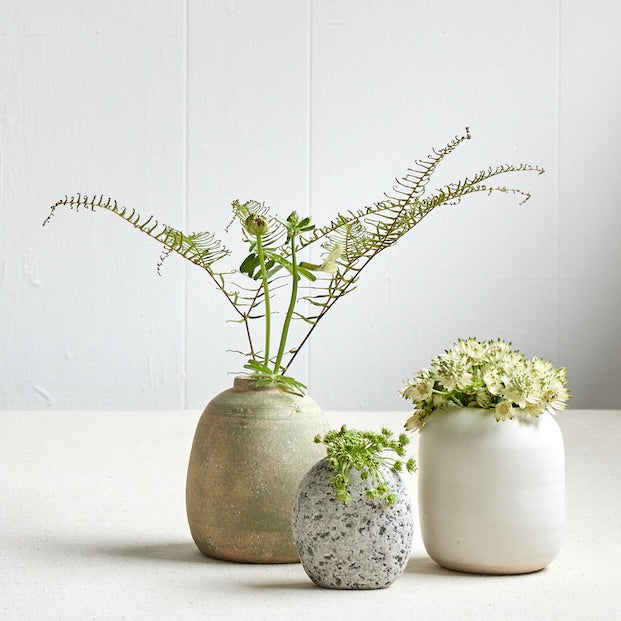 Handcrafted stoneware vases with different textures