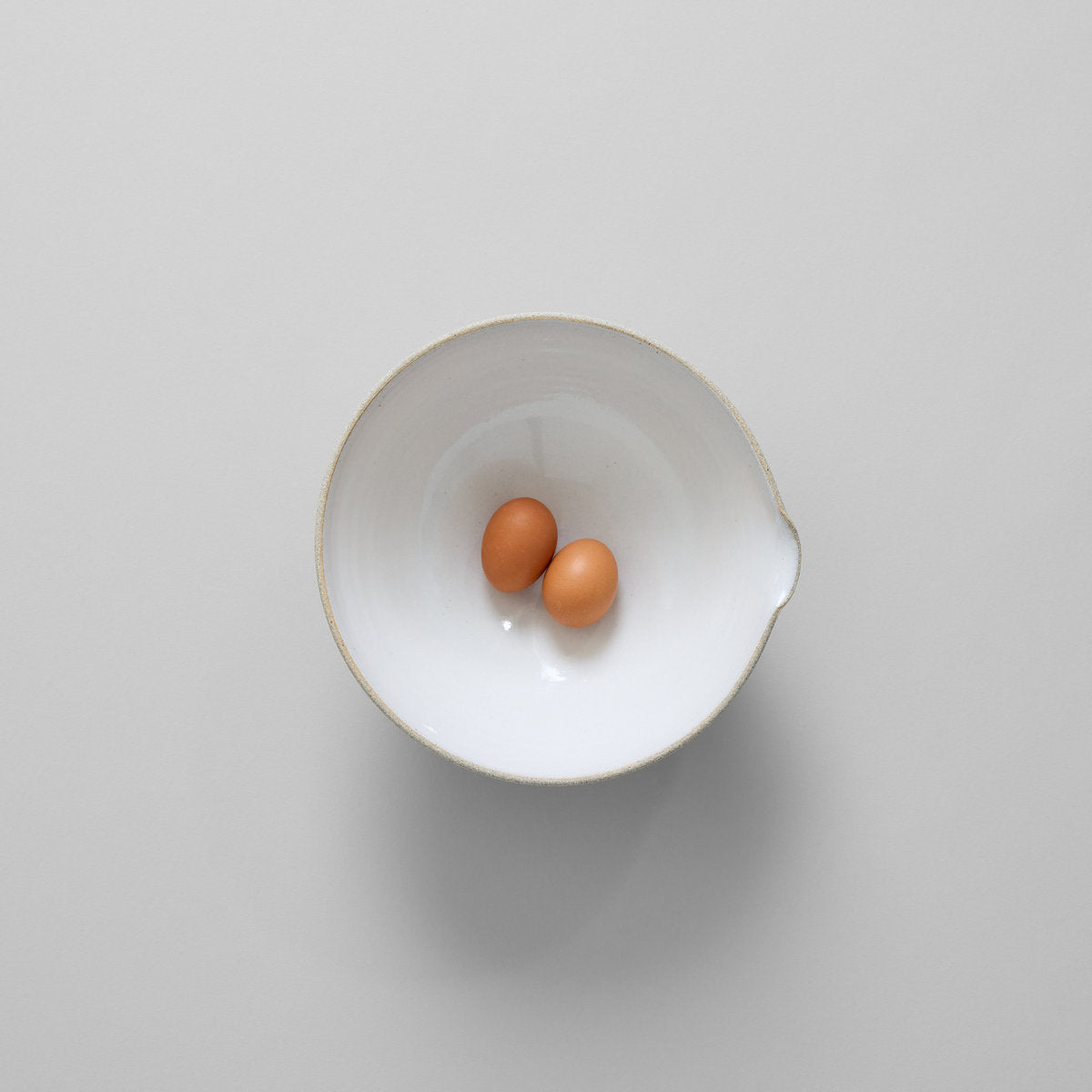 Small stoneware mixing bowl with spout for pouring batter and sauces