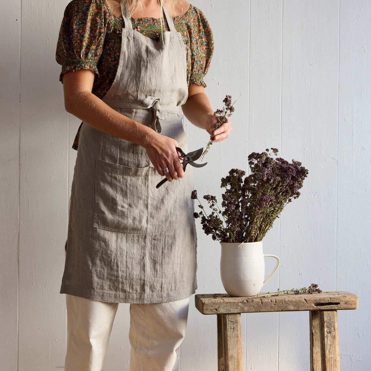 Stonewashed natural linen apron with adjustable waist ties and pockets
