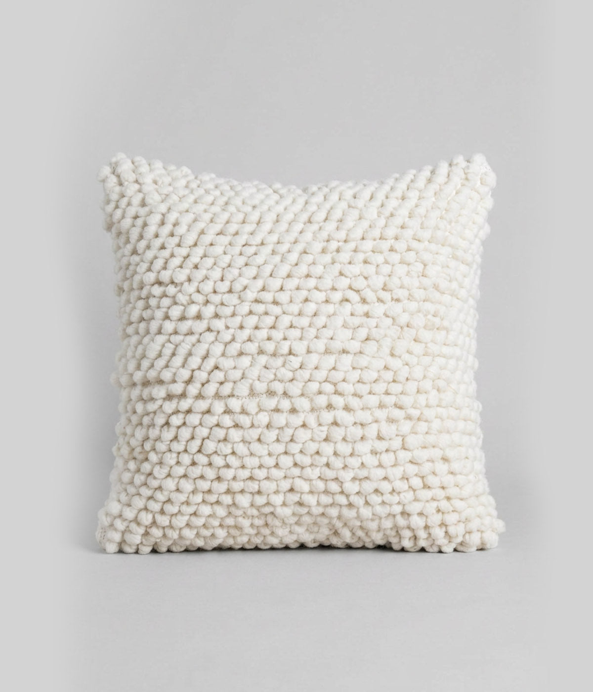 Textured throw pillows made from 100% undyed hand-spun wool
