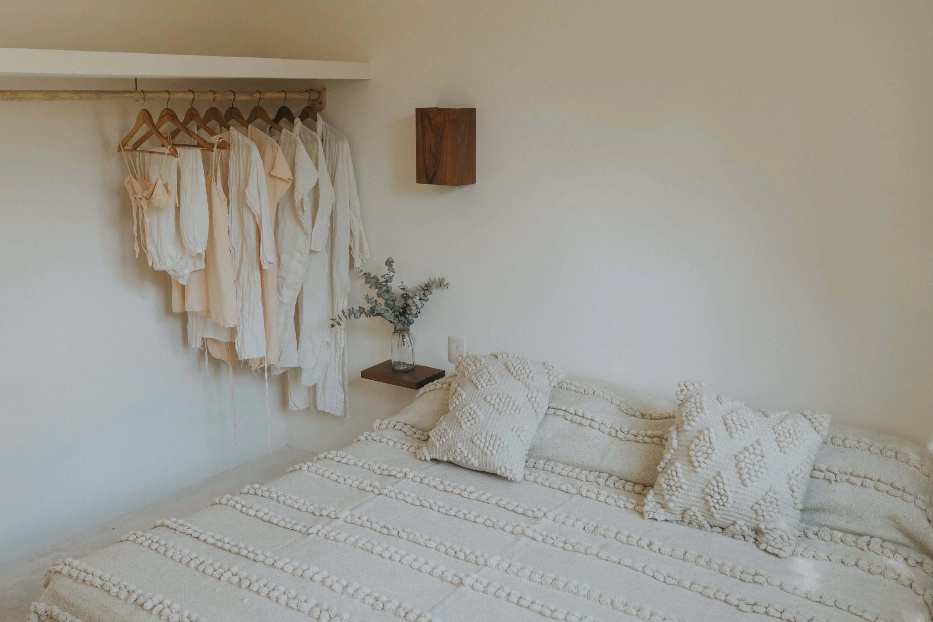100% wool blanket with raised pompom rows and chunky tassel details