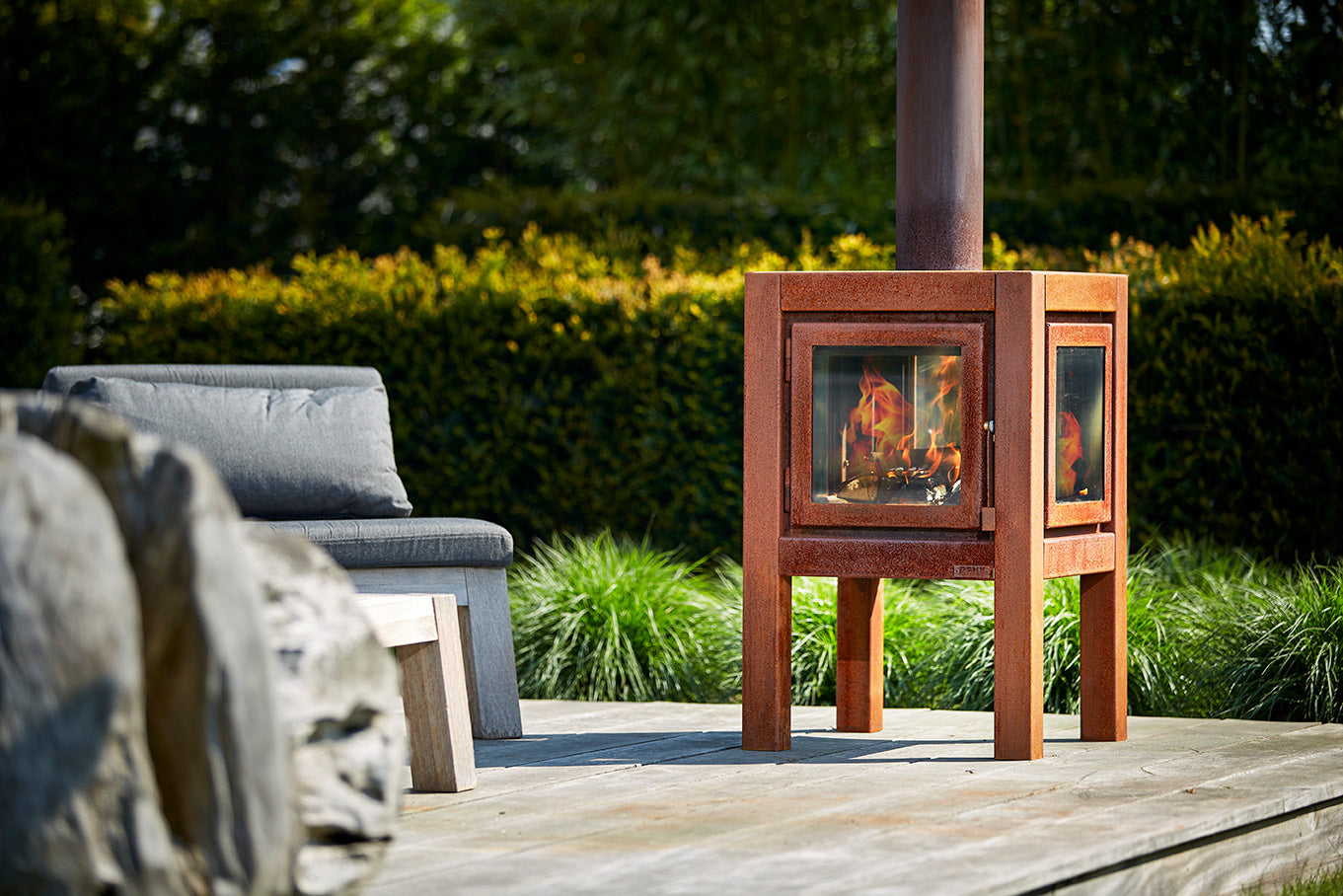 space saving outdoor fireplace with glass