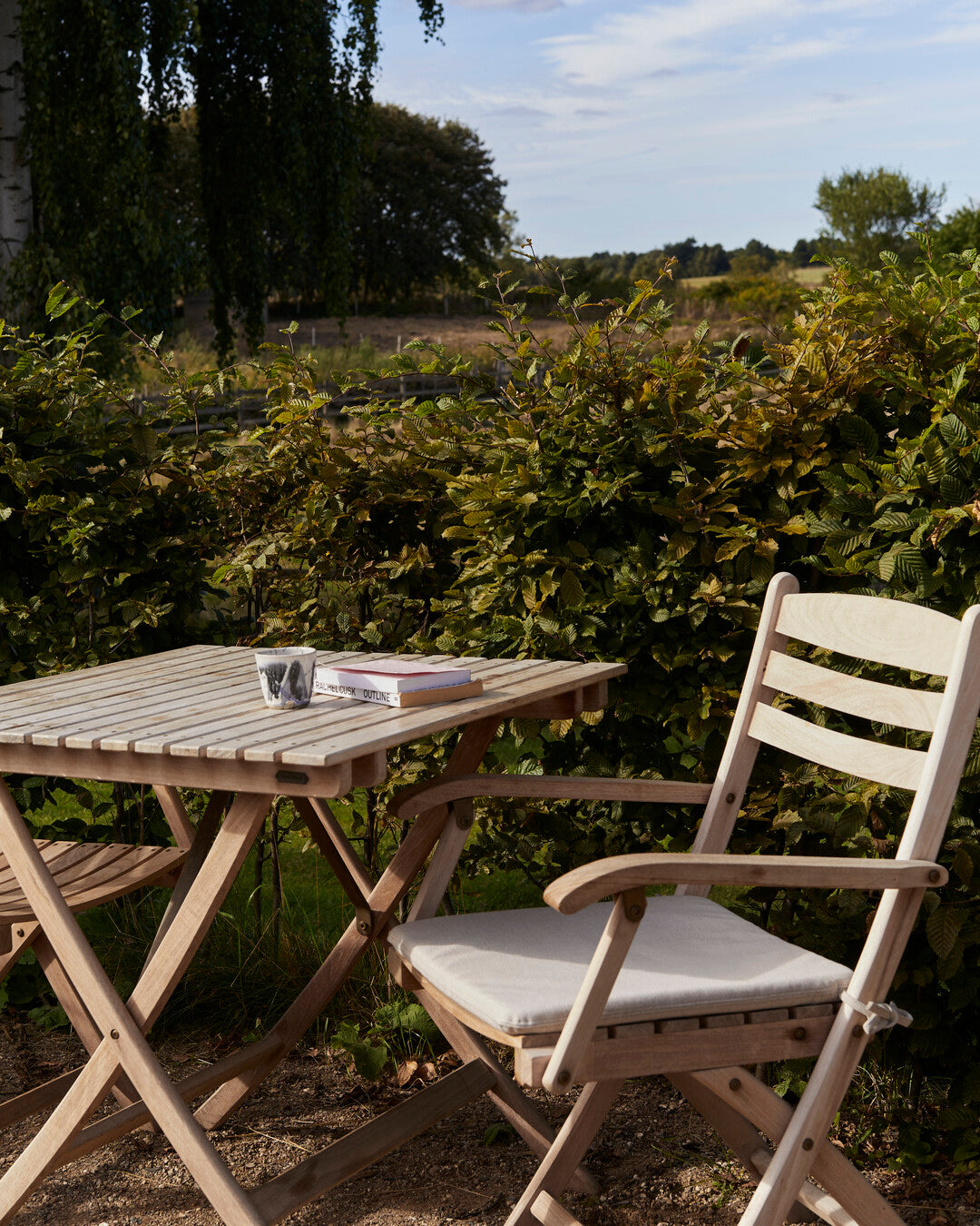 Weather-resistant teak armchair
