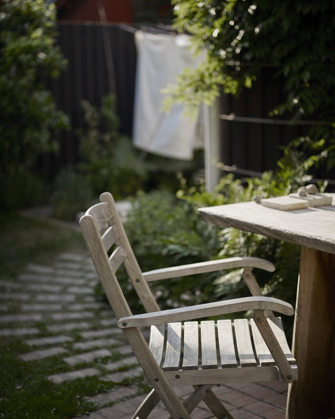 Sturdy teak wood folding armchair

