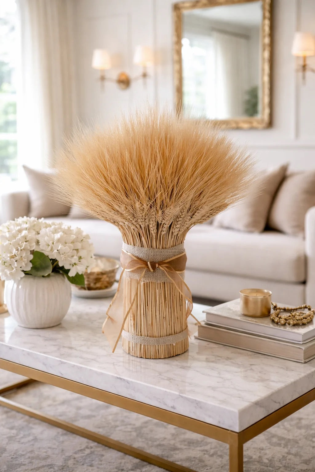 Farmhouse centerpiece made with dried wheat, corn husks, and burlap ribbon