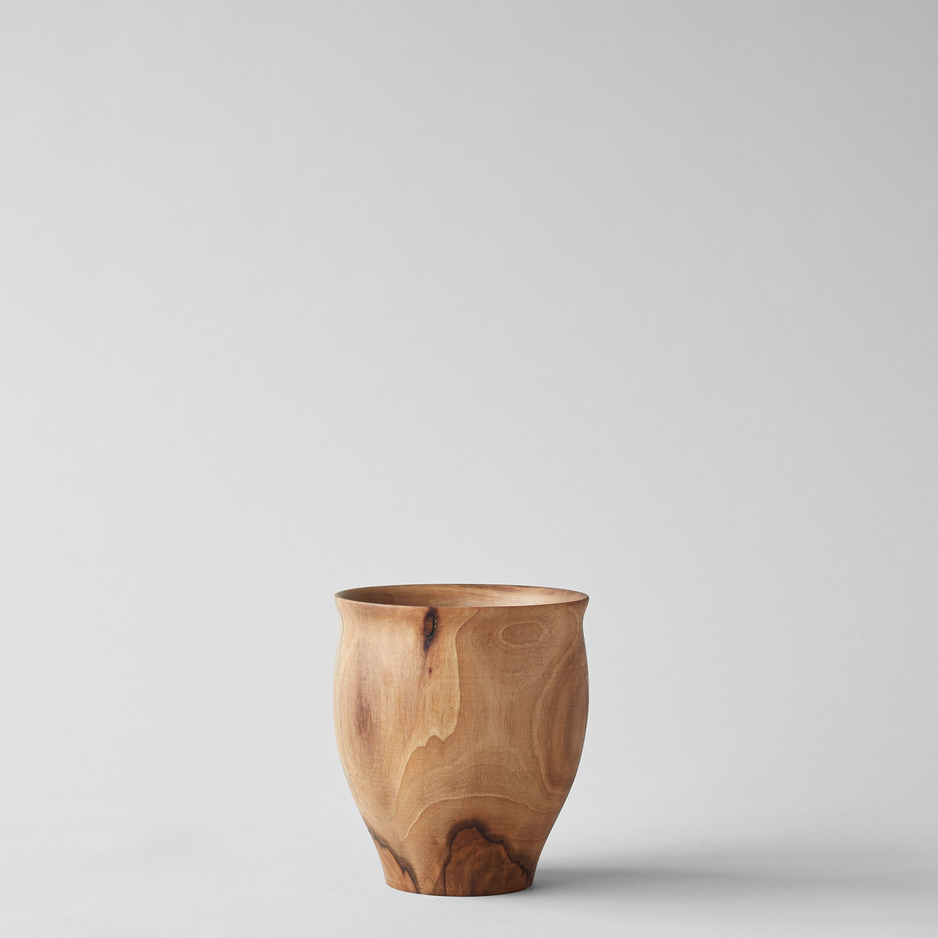 Large wood vase with rounded bell form