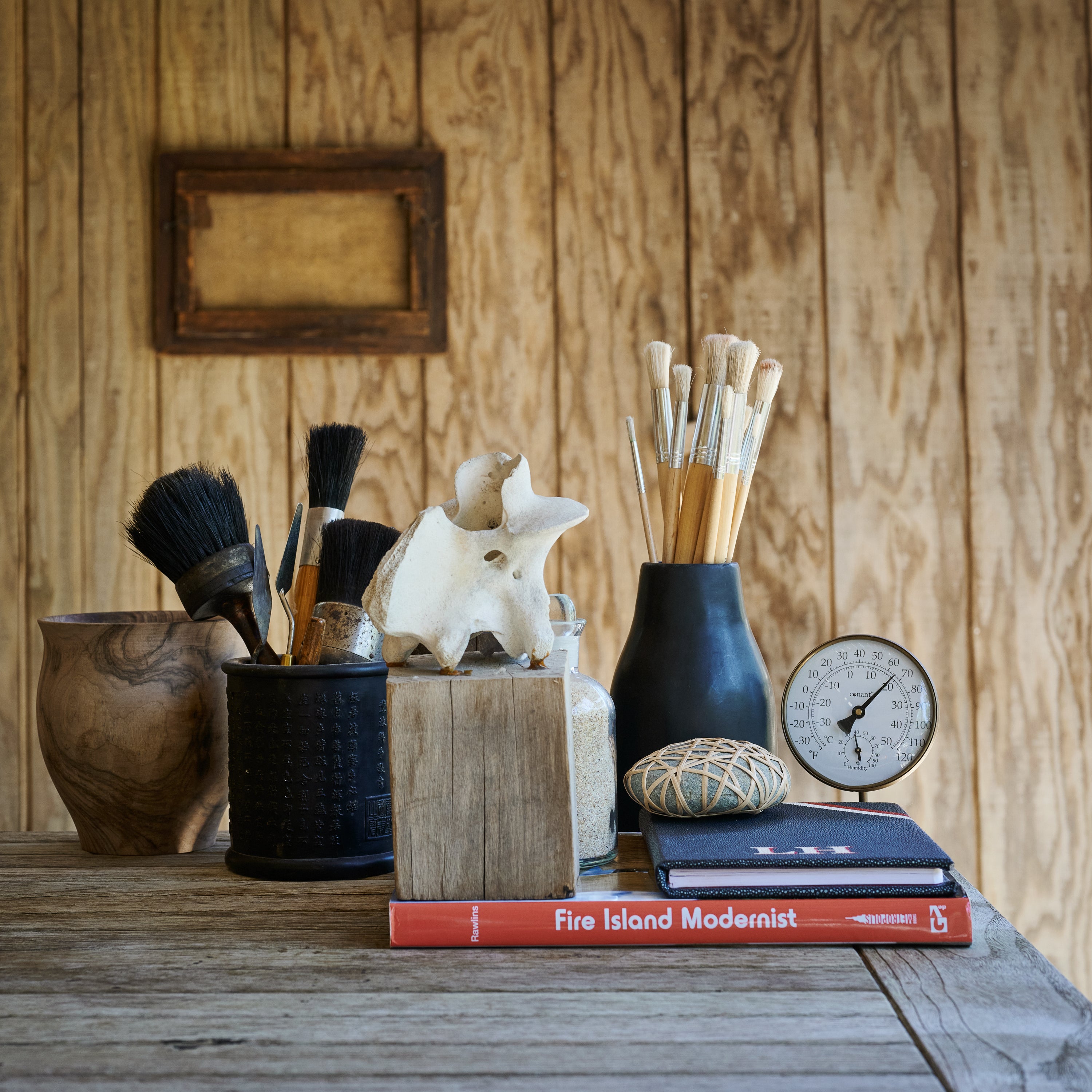 Minimal black tadelakt vase displayed as sculptural object