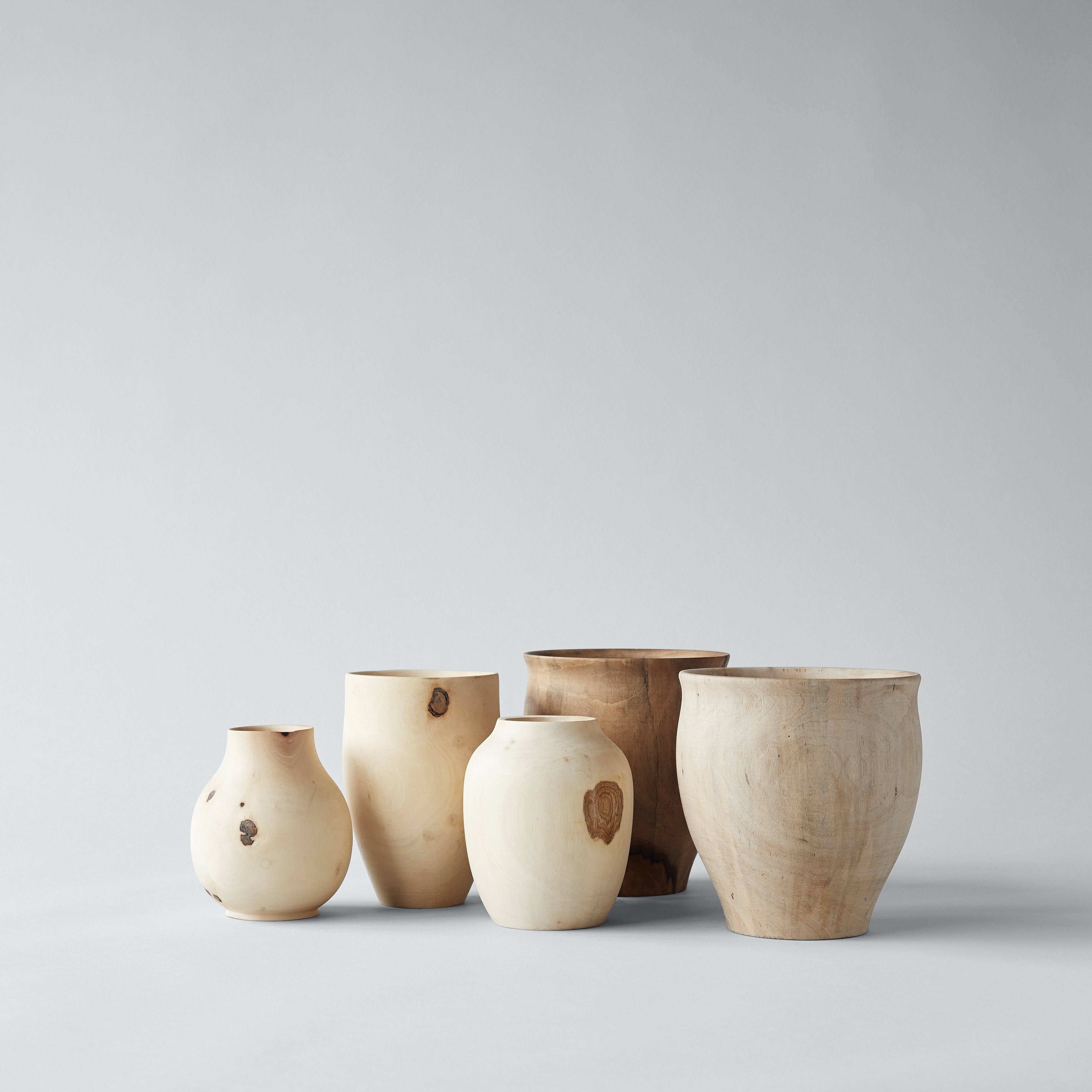 Carved wood vases made from raw white walnut