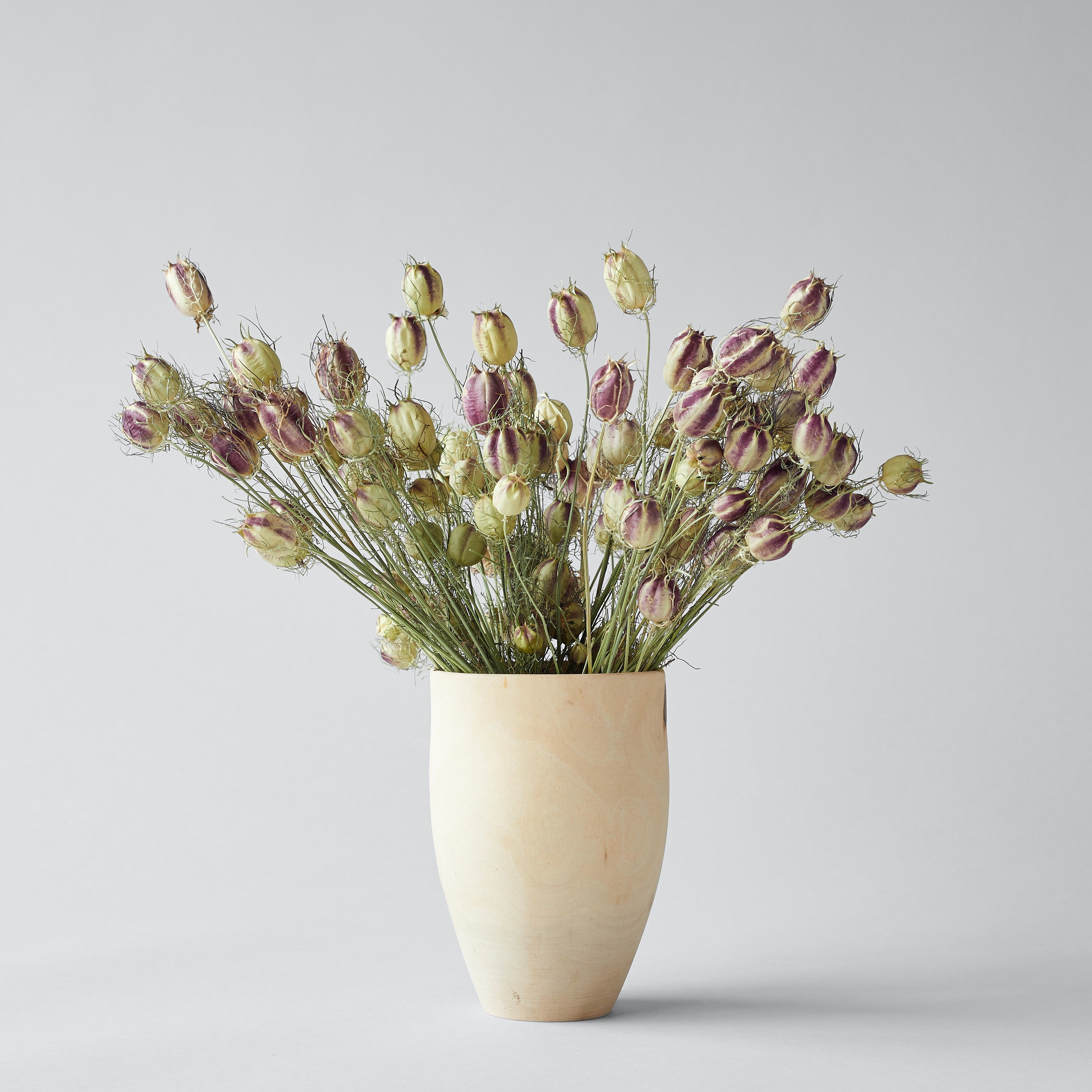 Handcrafted wooden tulip vase in raw white walnut
