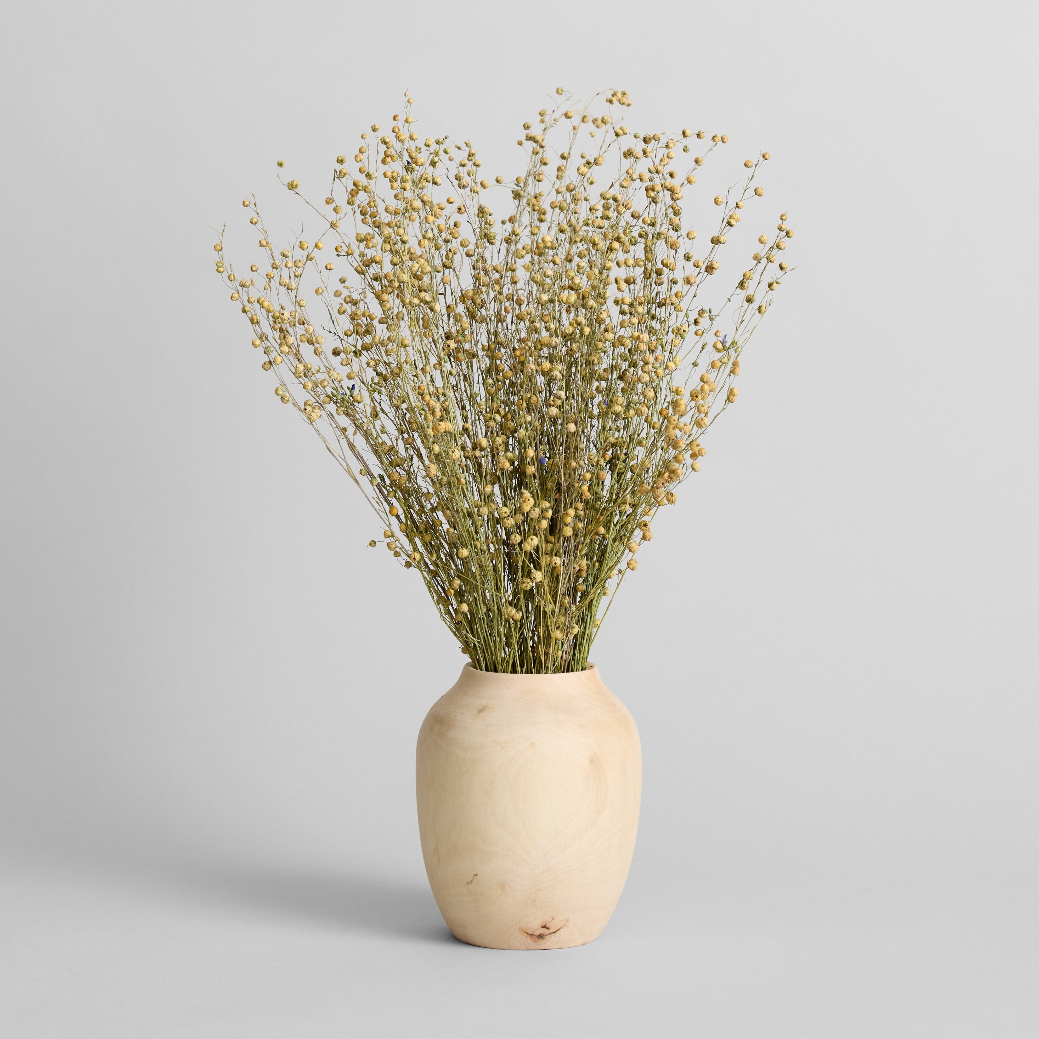 Artisan walnut wood vase with smooth hand-carved surface