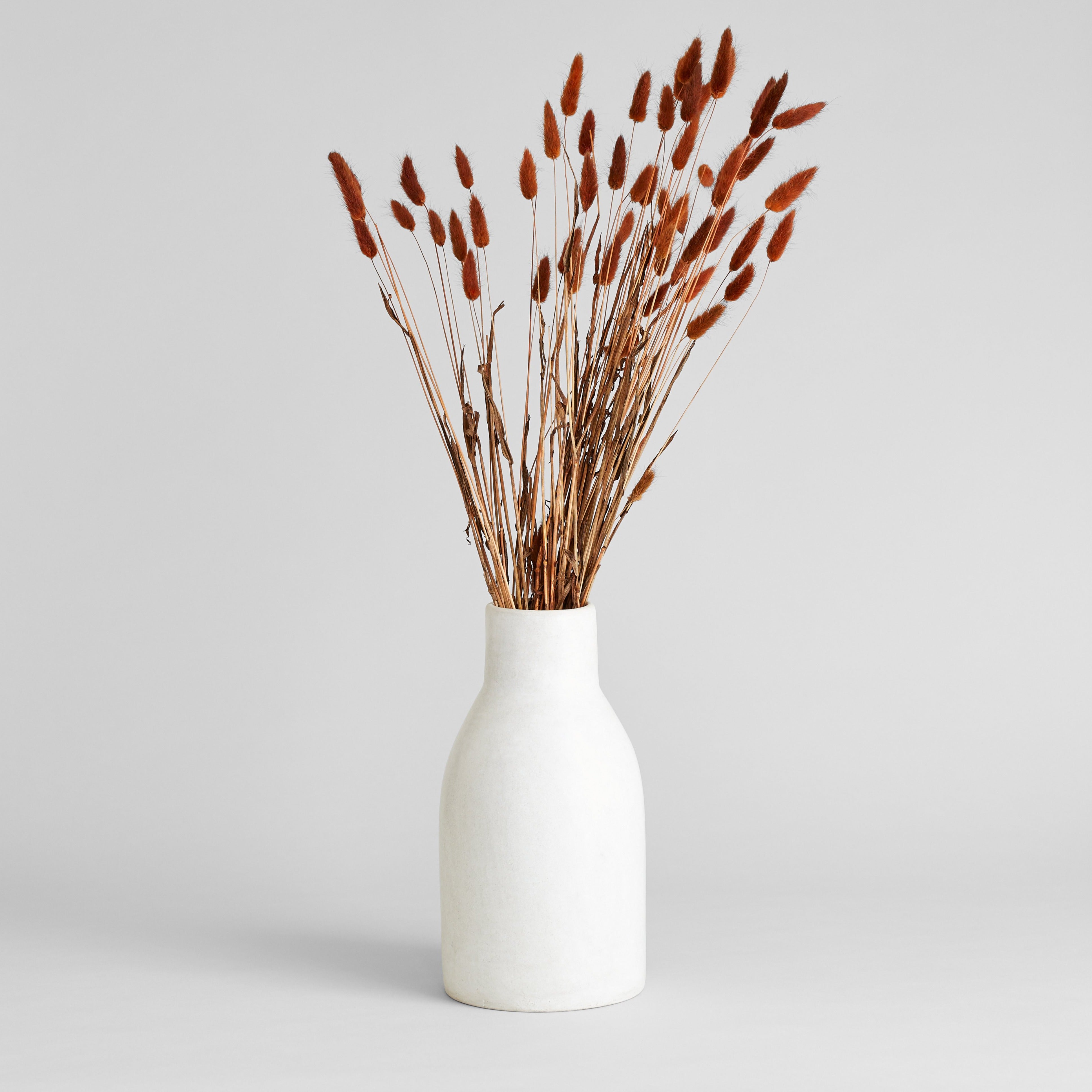 Hand crafted ceramic white vase with rounded bottle shape