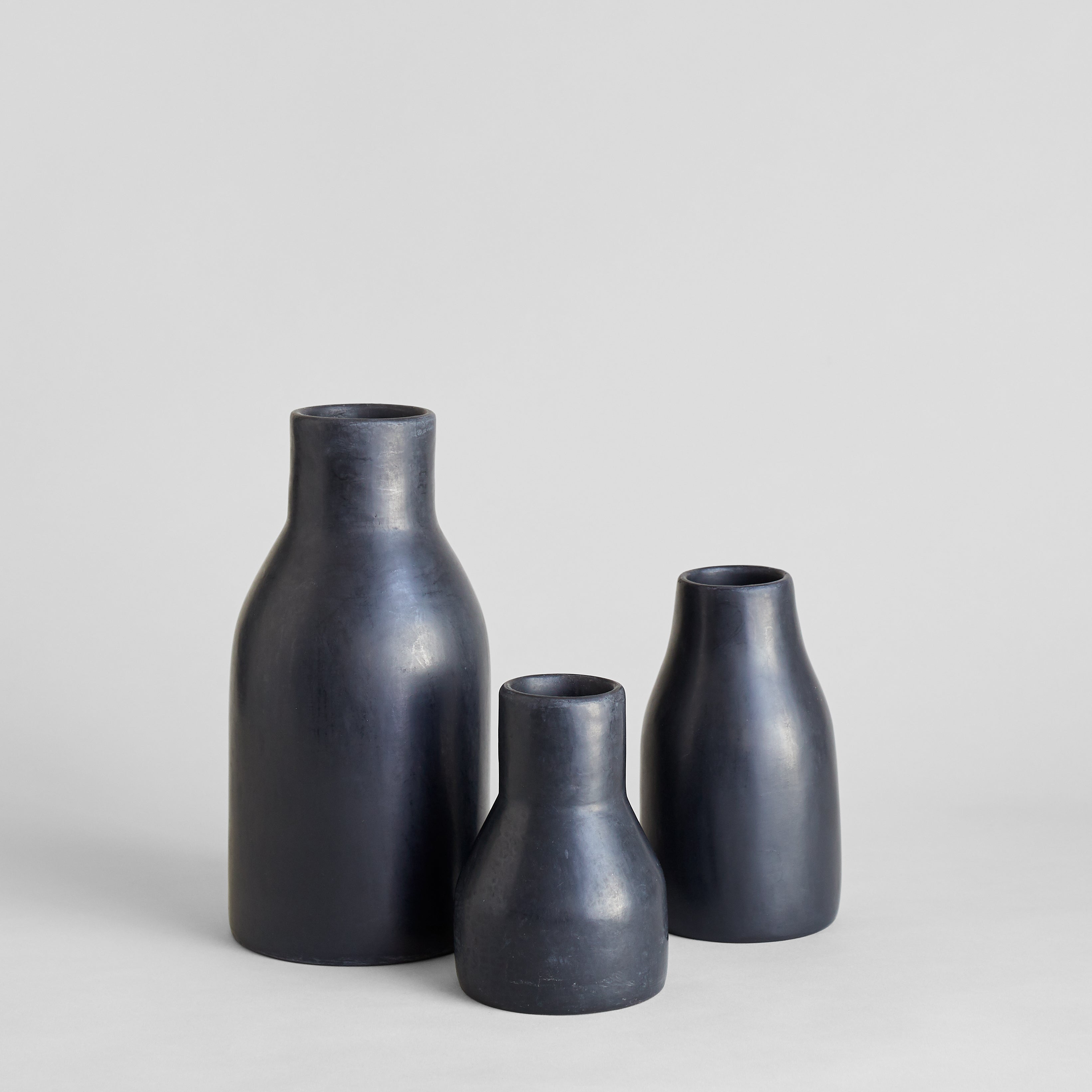 Monolithic black Moroccan vase with smooth hand-polished surface