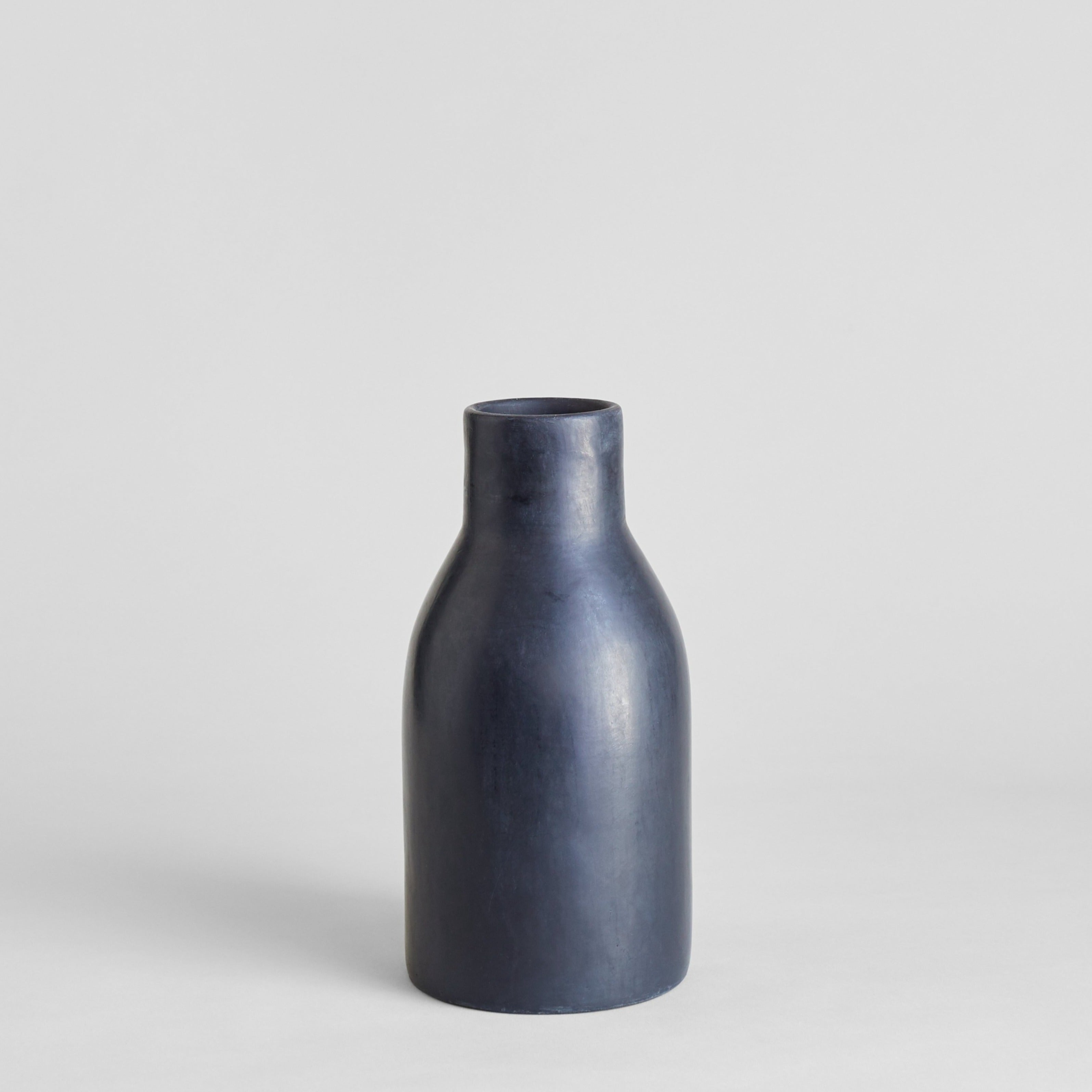 Black tadelakt vase in large with rounded body and narrow opening